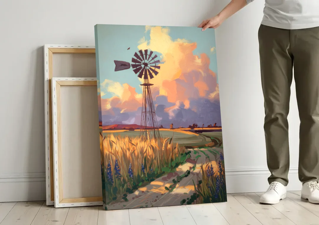 Lubbock Windmill Scene canvas wall art leaning against a wall next to blank canvases