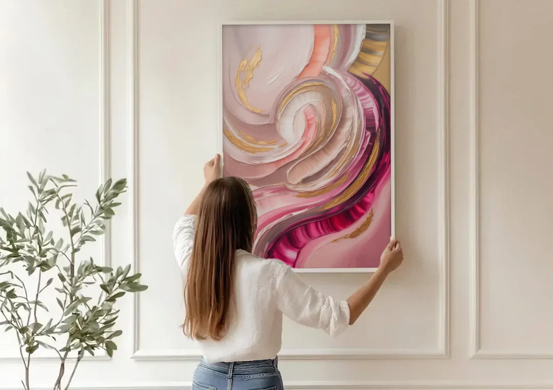 Luminous Swirl Pink Abstract canvas wall art being hung on a paneled wall