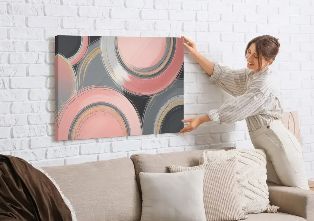 Luxurious Elegance Pink and Grey Abstract canvas wall art being hung on a white brick wall above a sofa