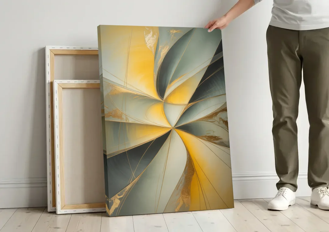 Luxurious Forms Yellow and Grey Abstract canvas wall art leaning against a wall next to blank canvases