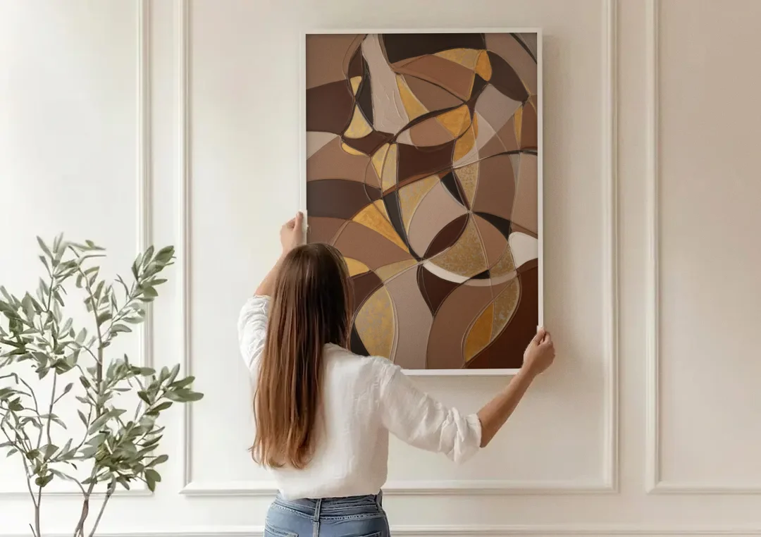 Luxurious Geometric Harmony Brown Abstract canvas wall art being hung on a paneled wall