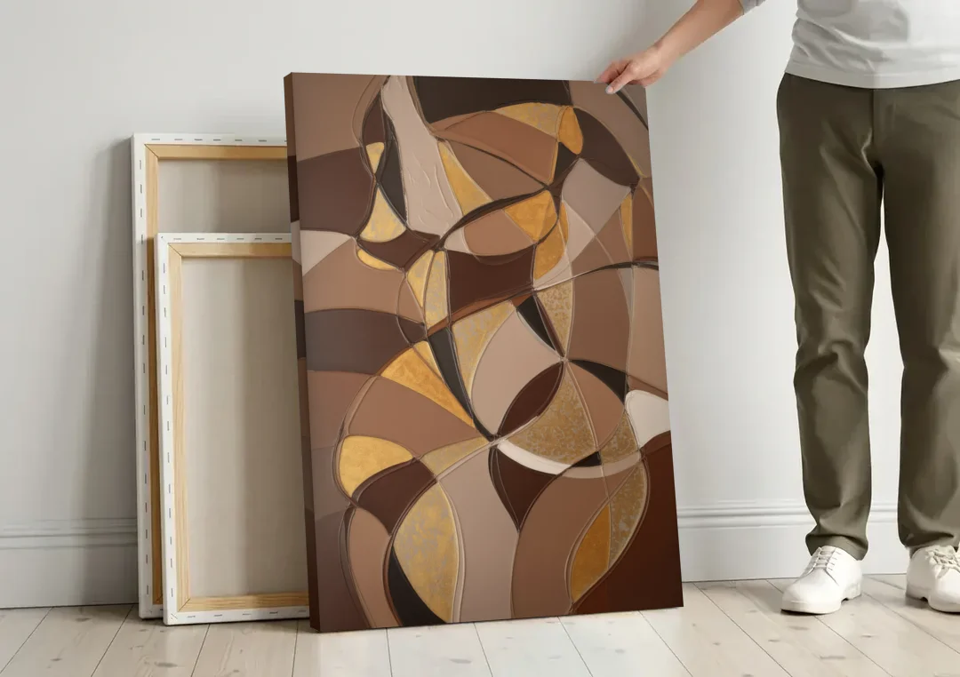 Luxurious Geometric Harmony Brown Abstract canvas wall art leaning against a wall next to blank canvases