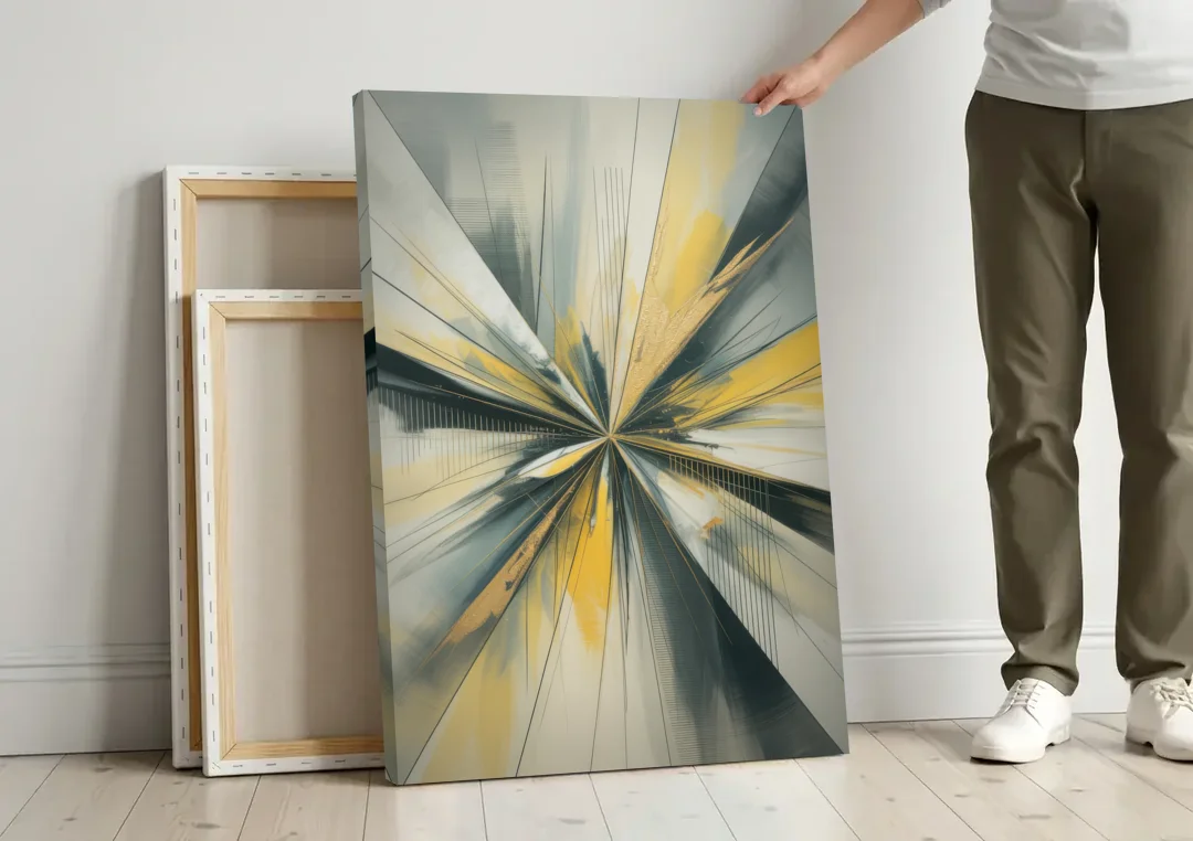 Luxurious Geometric Yellow and Grey Abstract canvas wall art leaning against a wall next to blank canvases