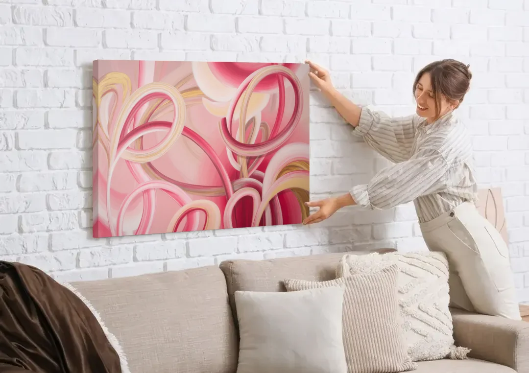 Luxurious Interwoven Pink Abstract canvas wall art being hung on a white brick wall above a sofa