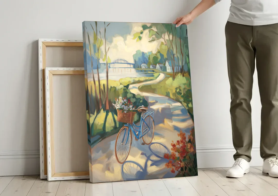 Mackinac Island Bicycle Path canvas wall art leaning against a wall next to blank canvases