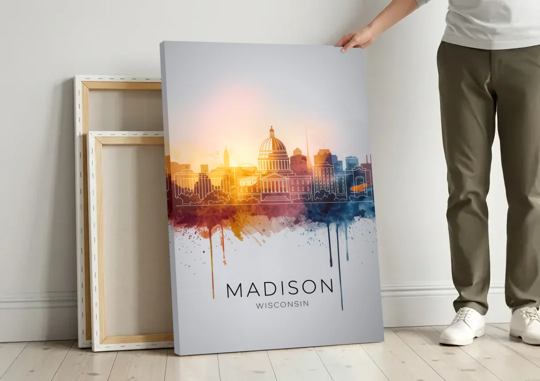 Madison Iconic Landmarks canvas wall art leaning against a wall next to blank canvases