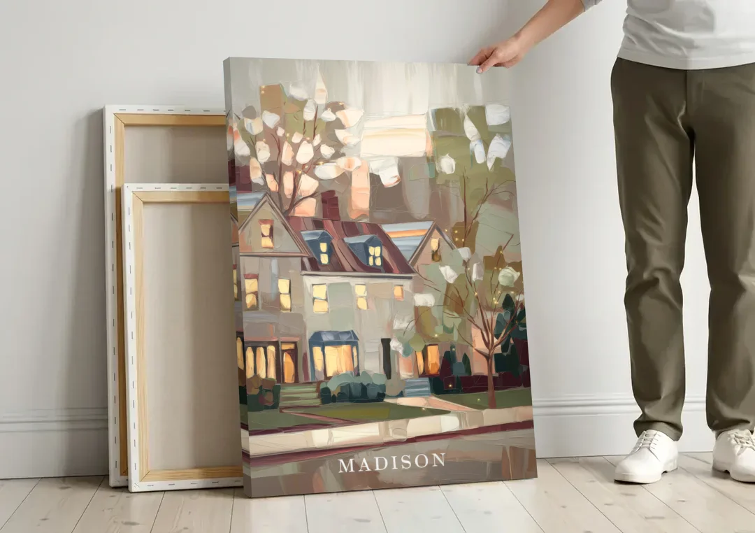 Madison Neighborhood Charm canvas wall art leaning against a wall next to blank canvases