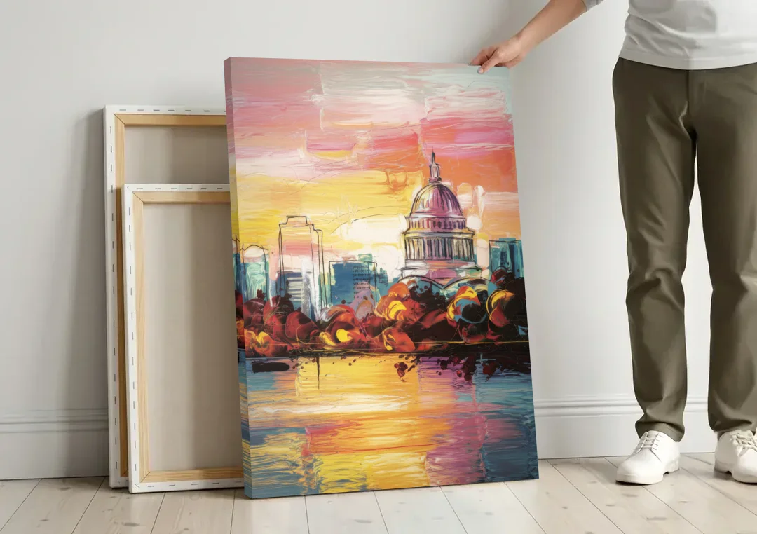 Madison Skyline at Sunset canvas wall art leaning against a wall next to blank canvases