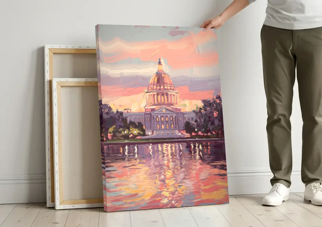 Madison Sunset Over Capitol canvas wall art leaning against a wall next to blank canvases