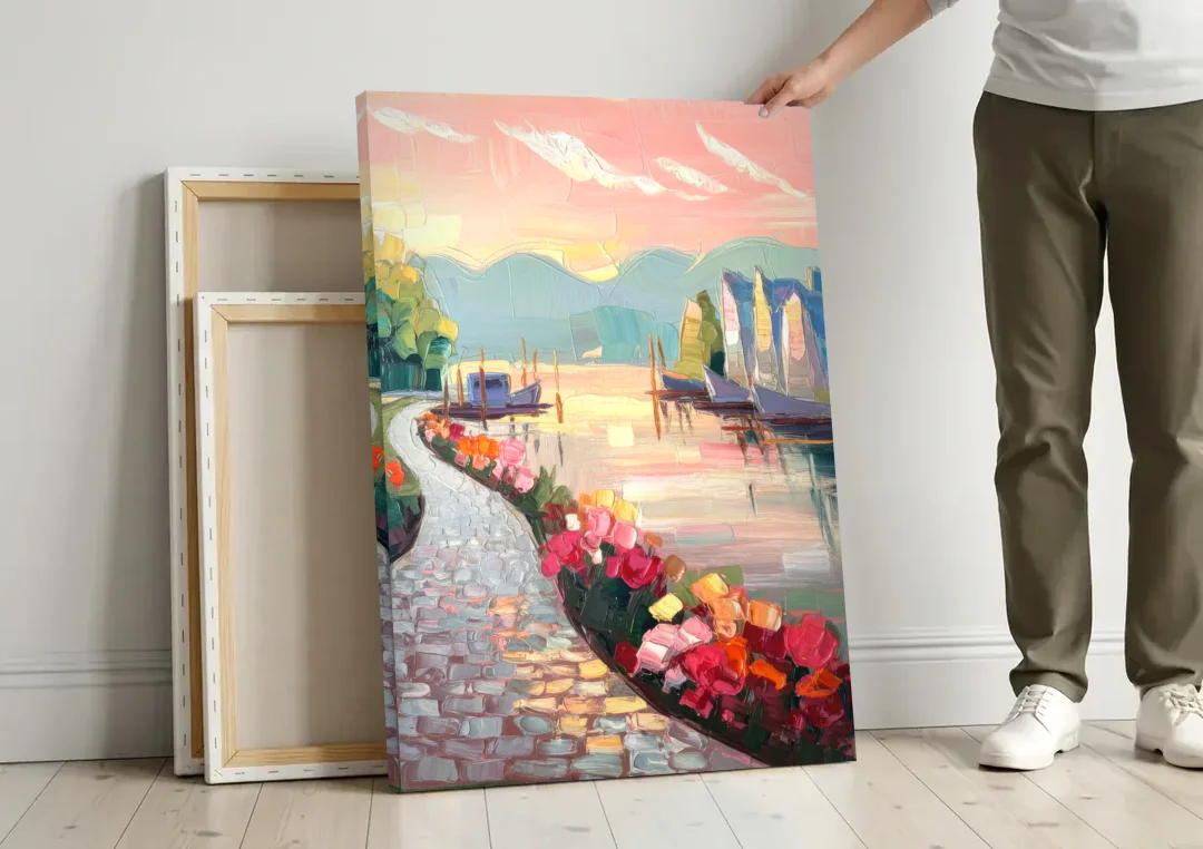 Madison Waterfront Stroll canvas wall art leaning against a wall next to blank canvases