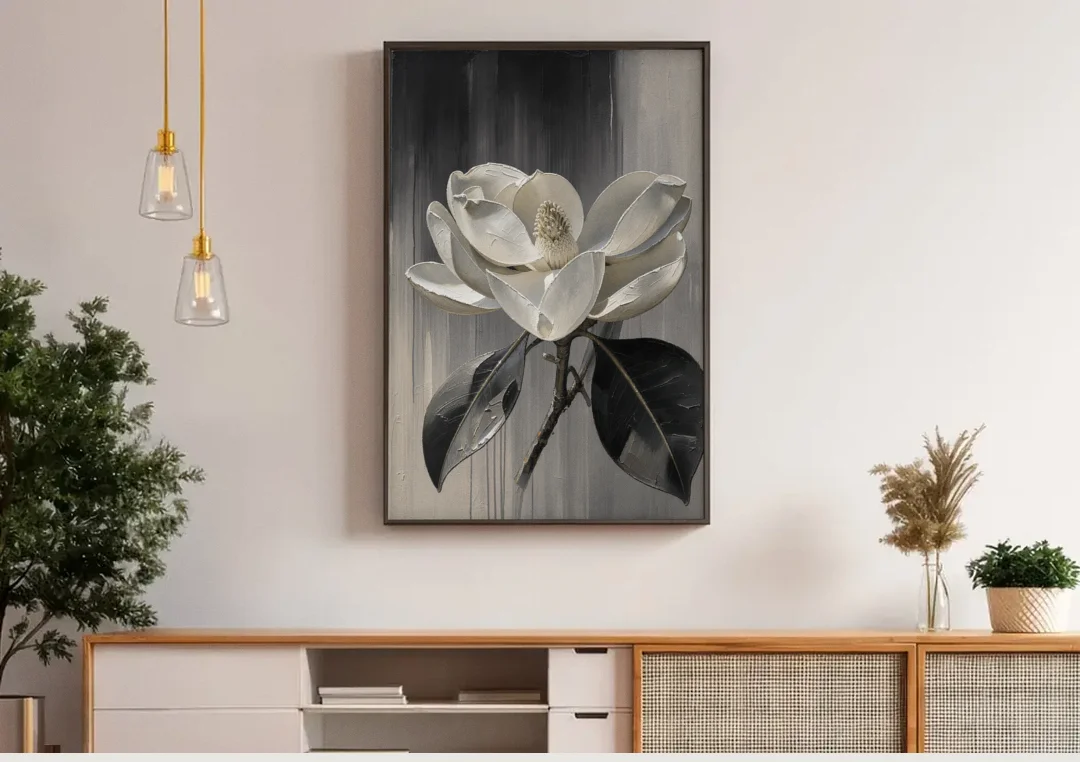 Magnolia Canvas Art with a Single White Bloom canvas wall art above a wooden sideboard under pendant lights
