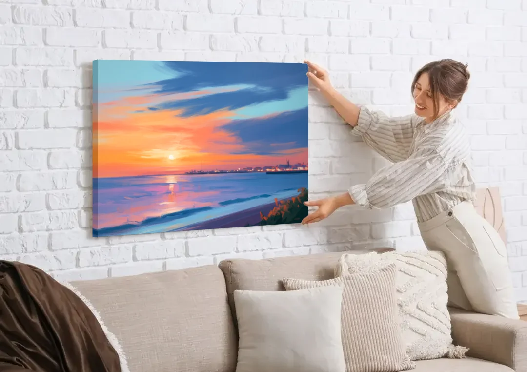 Malecon Campeche Sunset canvas wall art being hung on a white brick wall above a sofa