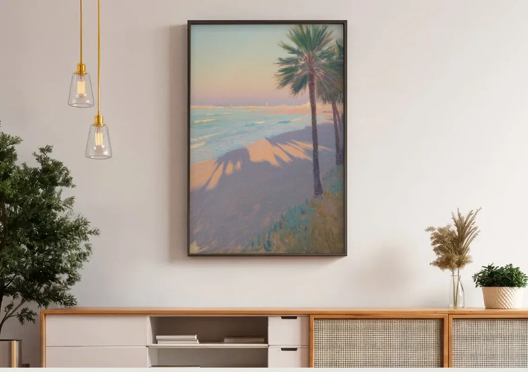 Malvarrosa Beach canvas wall art above a wooden sideboard under pendant lights