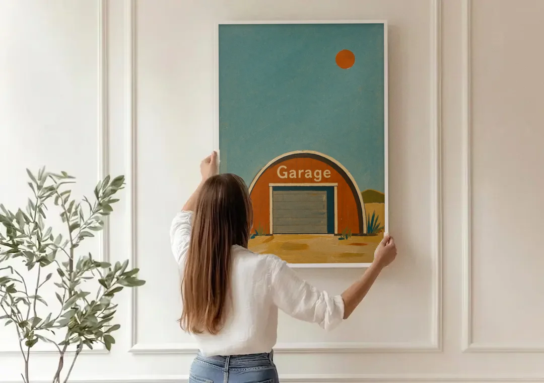 Man Cave Signs Quonset Garage Under an Orange Sun canvas wall art being hung on a paneled wall