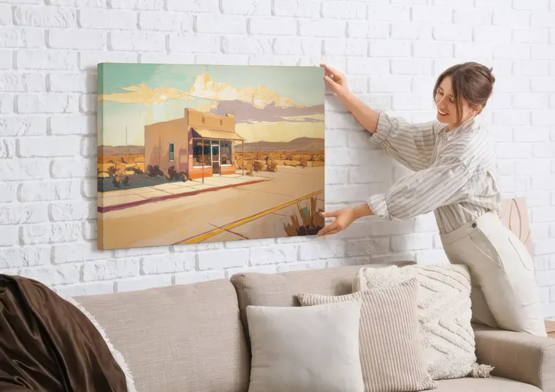 Marfa Roadside Charm canvas wall art being hung on a white brick wall above a sofa