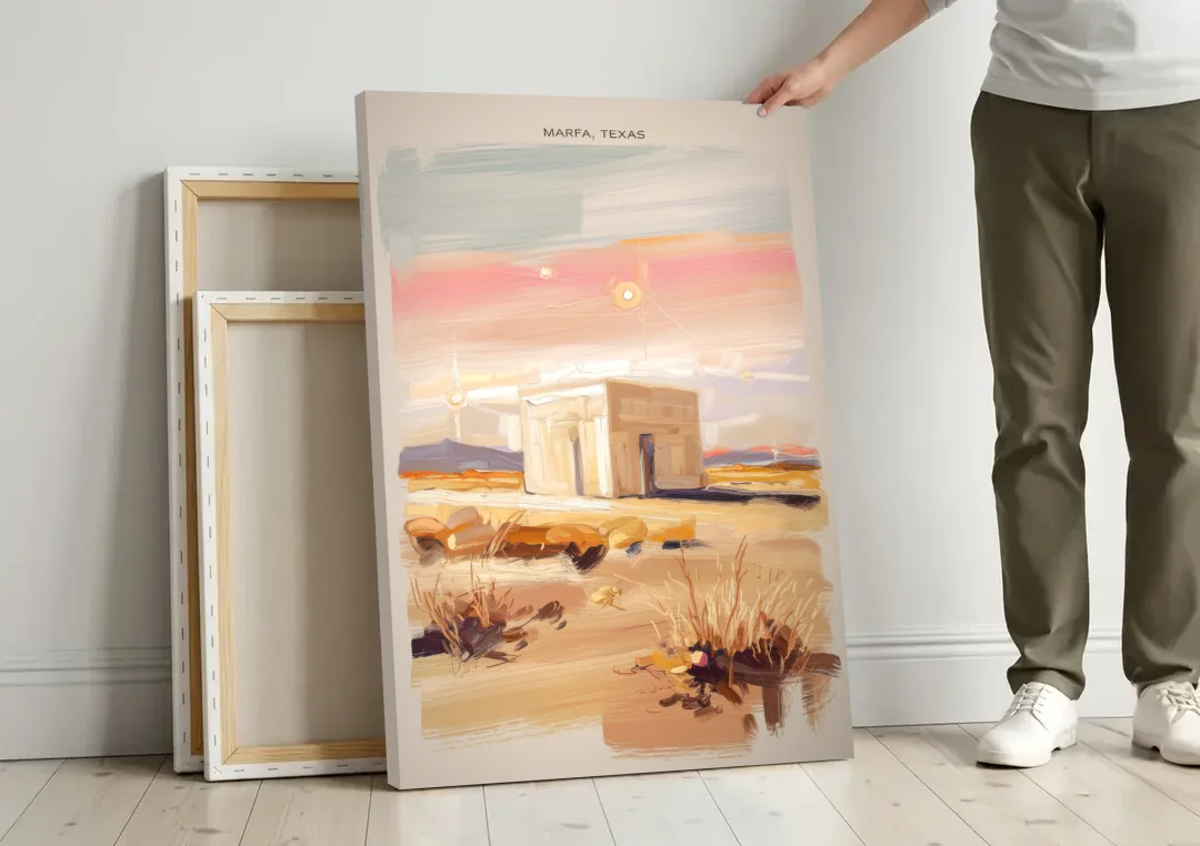 Marfa Scenic Beauty canvas wall art leaning against a wall next to blank canvases
