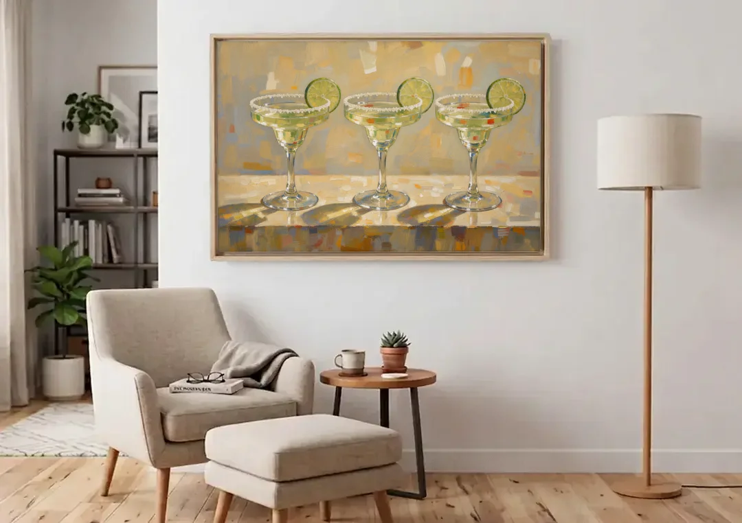 Margarita Painting Trio with Lime Wheels canvas wall art above an armchair in a bright living room