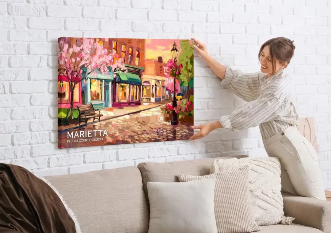 Marietta Cobb County Scenes canvas wall art being hung on a white brick wall above a sofa
