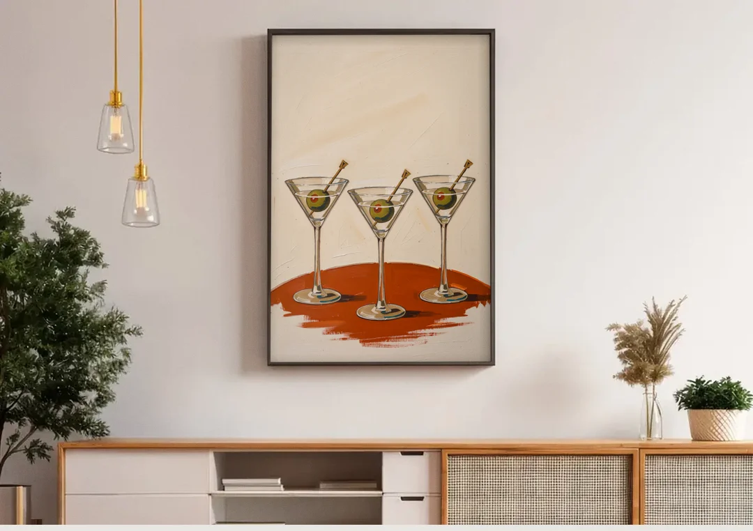 Martini Wall Art Trio with Green Olives canvas wall art above a wooden sideboard under pendant lights