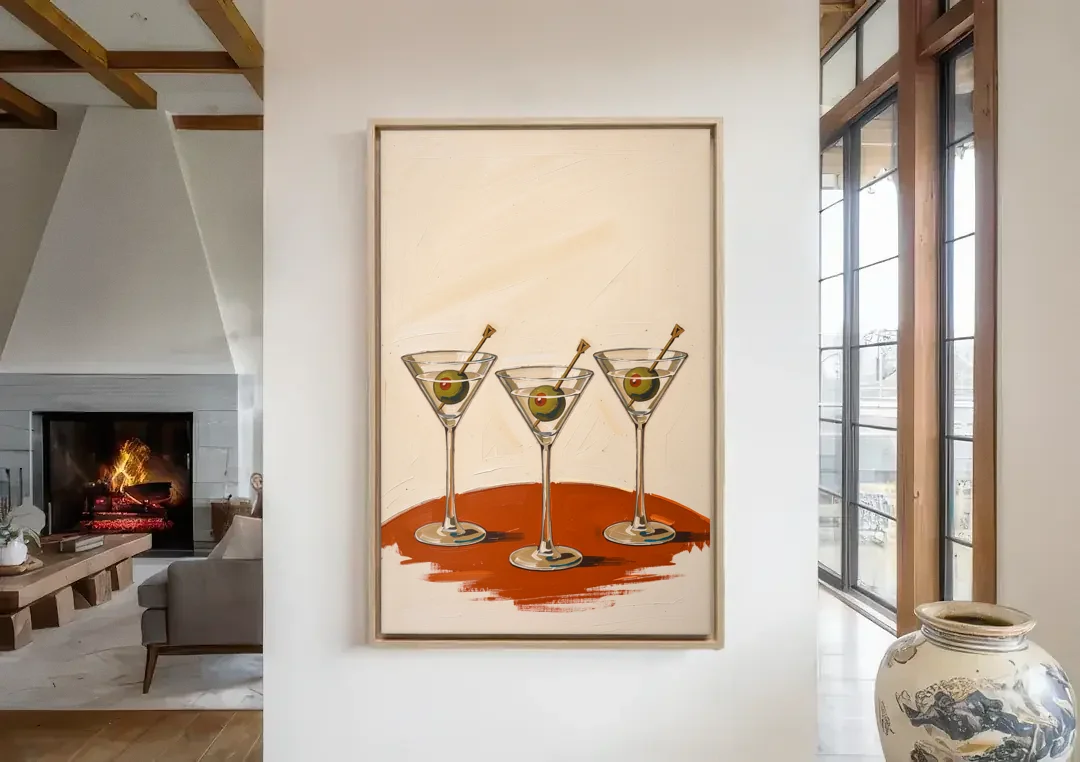 Martini Wall Art Trio with Green Olives canvas wall art in a living room with a fireplace