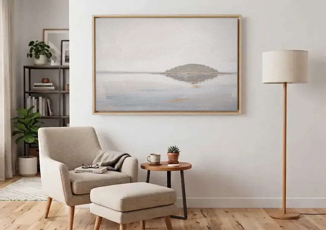 Matching Wall Art Set of 2 Mirrored Island canvas wall art above an armchair in a bright living room