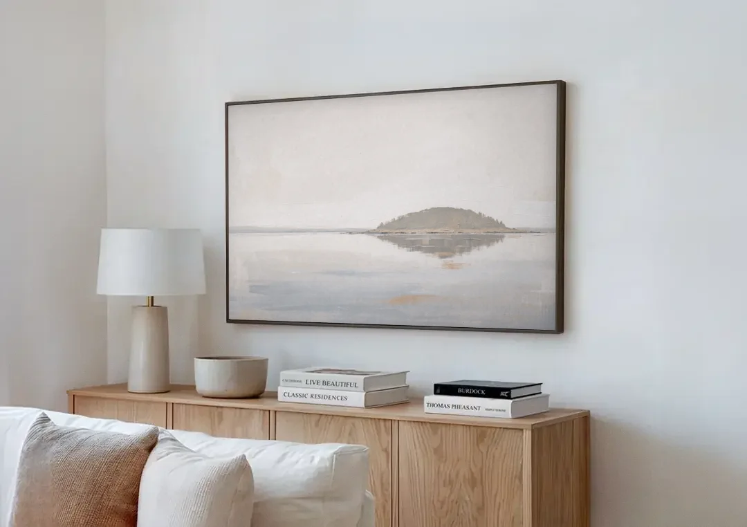Matching Wall Art Set of 2 Mirrored Island canvas wall art above a wooden sideboard next to a sofa