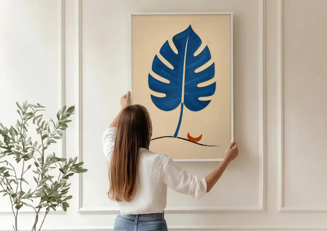 Matisse Wall Art Cobalt Leaf with Vermilion Moon canvas wall art being hung on a paneled wall