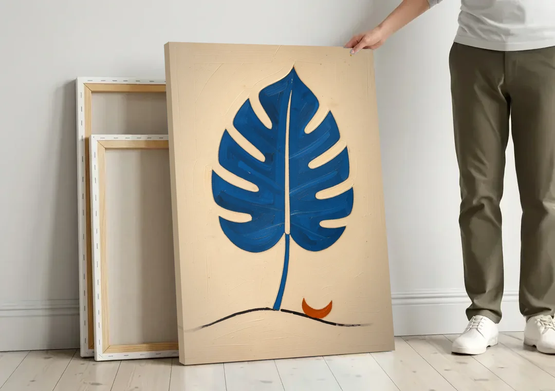 Matisse Wall Art Cobalt Leaf with Vermilion Moon canvas wall art leaning against a wall next to blank canvases