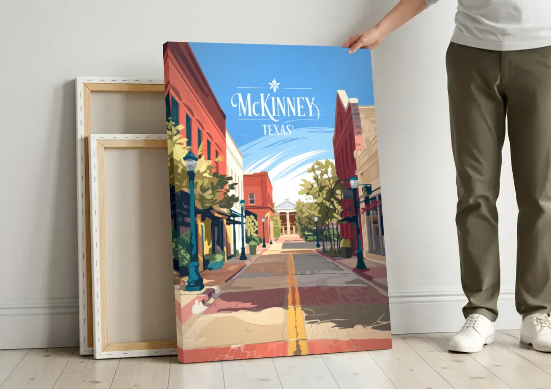 McKinney Downtown Streetscape canvas wall art leaning against a wall next to blank canvases