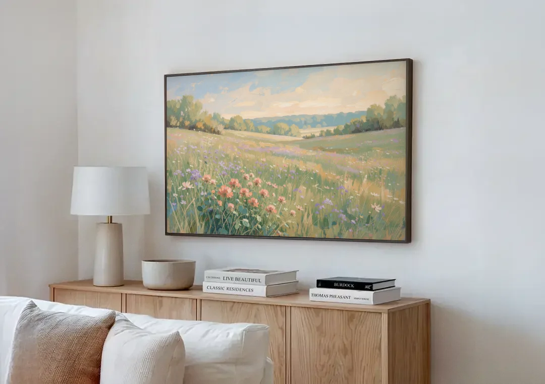 Meadow Landscape Painting with Coral Wildflowers canvas wall art above a wooden sideboard next to a sofa