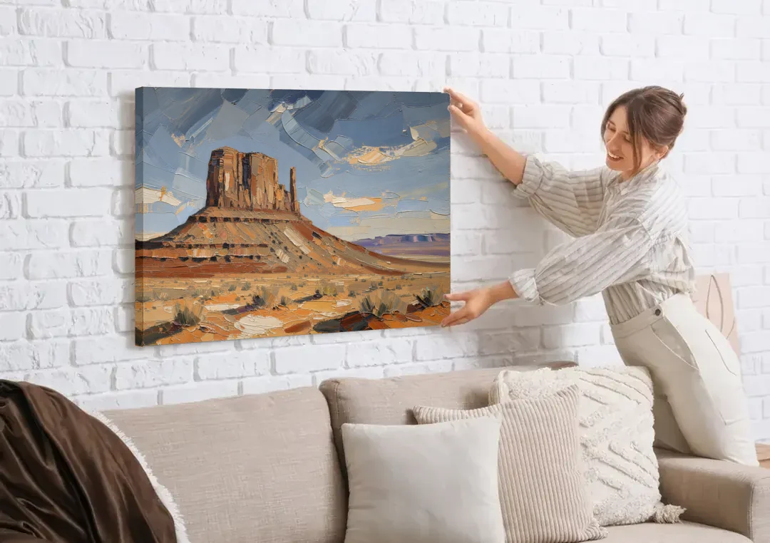 Men's Office Desert Mesa Under Slate Sky canvas wall art being hung on a white brick wall above a sofa