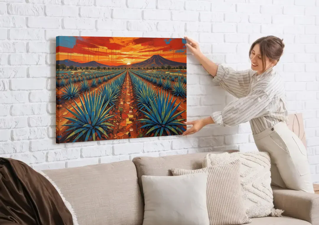 Mexican Landscape Painting of Blue Agave at Sunset canvas wall art being hung on a white brick wall above a sofa
