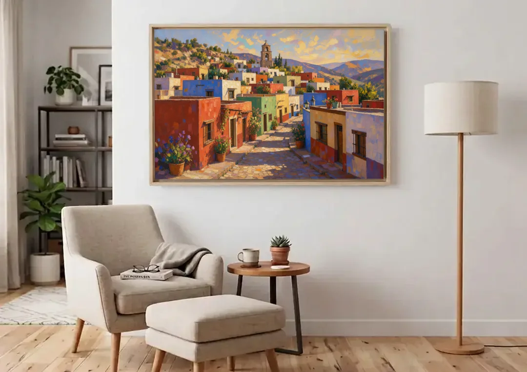 Mexican Village Painting With Hilltop Bell Tower canvas wall art above an armchair in a bright living room