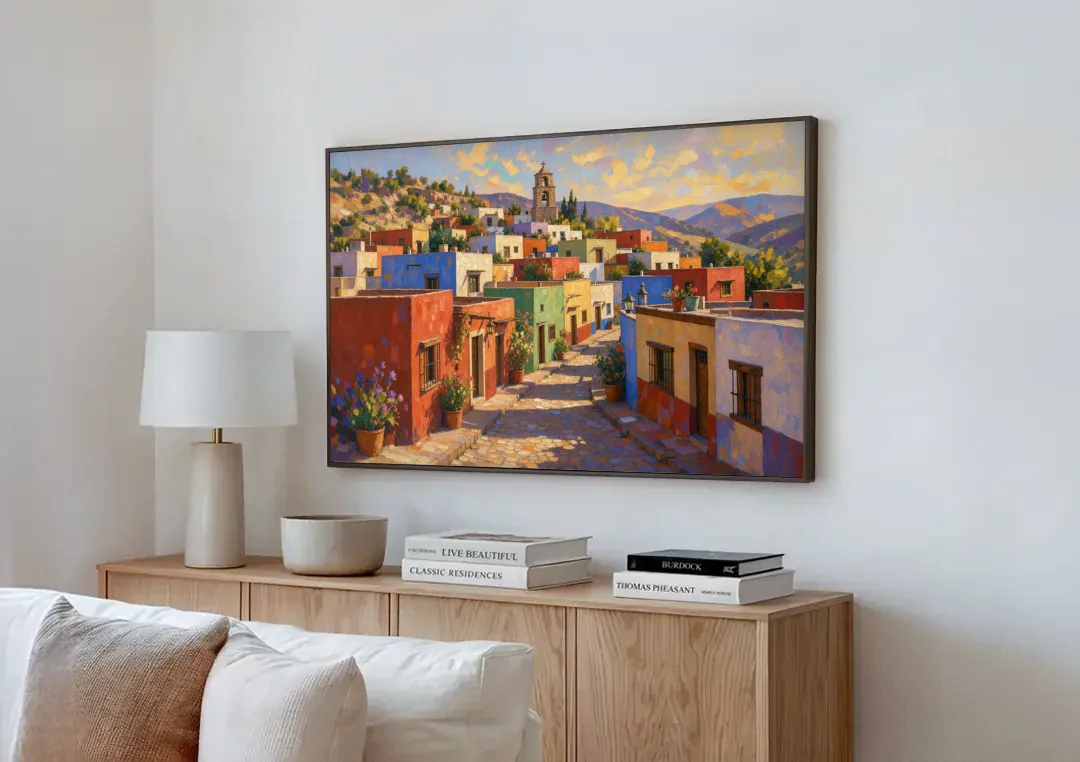 Mexican Village Painting With Hilltop Bell Tower canvas wall art above a wooden sideboard next to a sofa