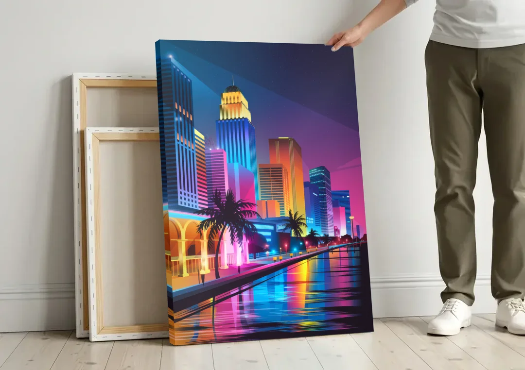 Miami Cityscape by Night canvas wall art leaning against a wall next to blank canvases