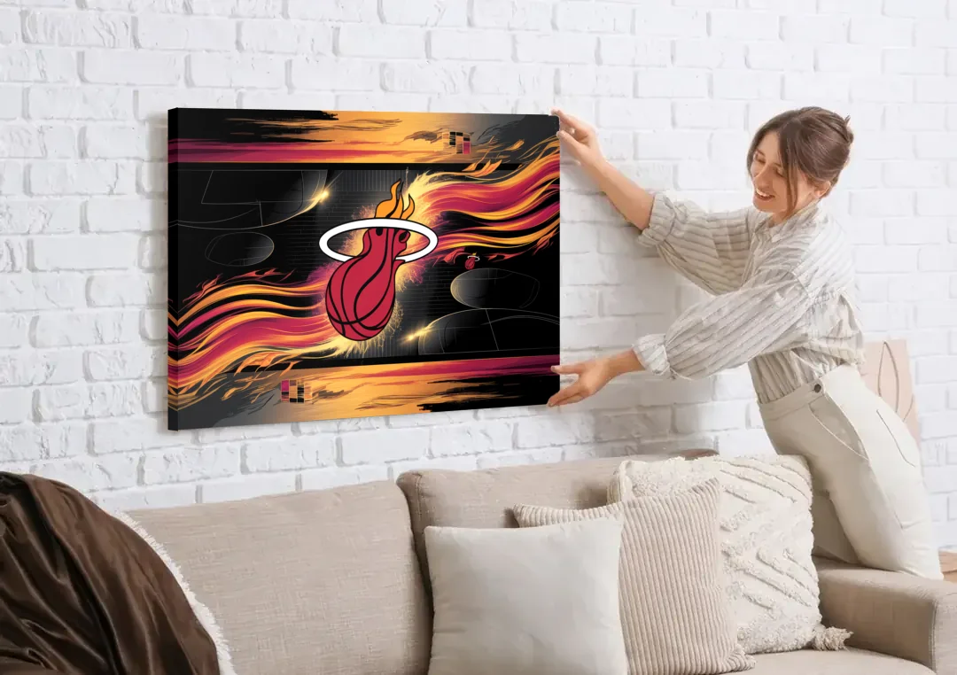 Miami Heat Basketball canvas wall art being hung on a white brick wall above a sofa