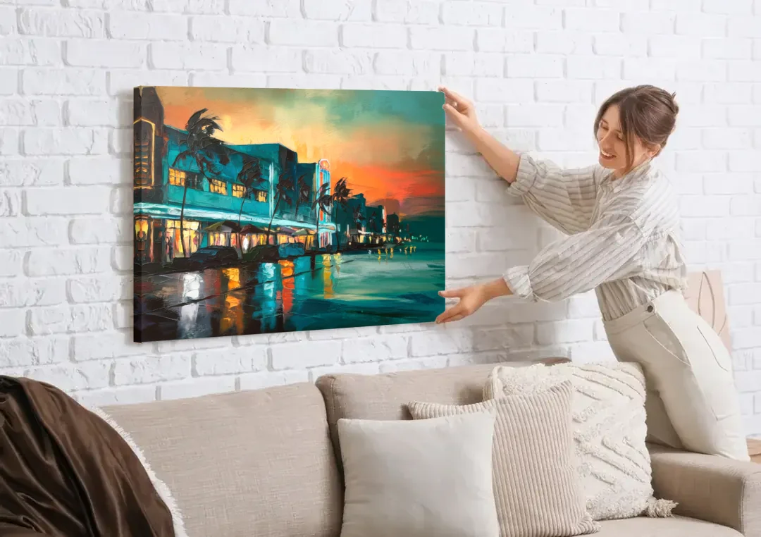 Miami Ocean Drive Lights canvas wall art being hung on a white brick wall above a sofa