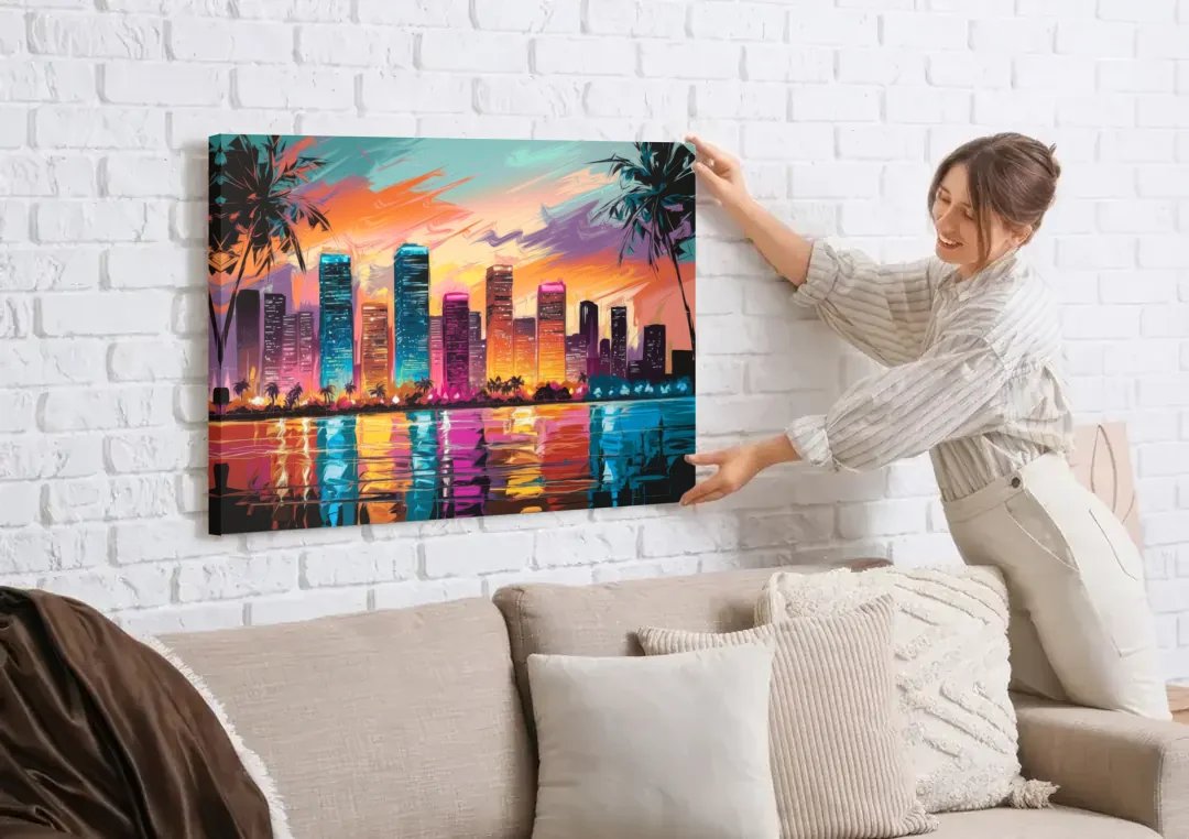 Miami Urban Sunset Glow canvas wall art being hung on a white brick wall above a sofa