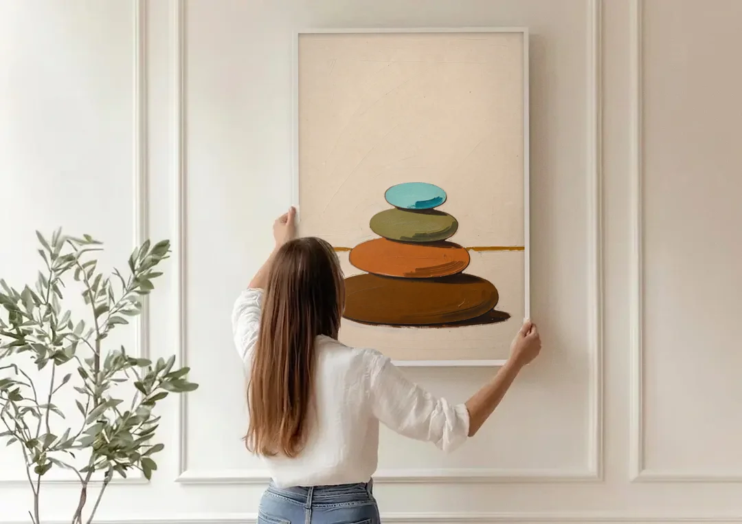 Mid Century Abstract Painting of a Leaning Pebble Cairn canvas wall art being hung on a paneled wall