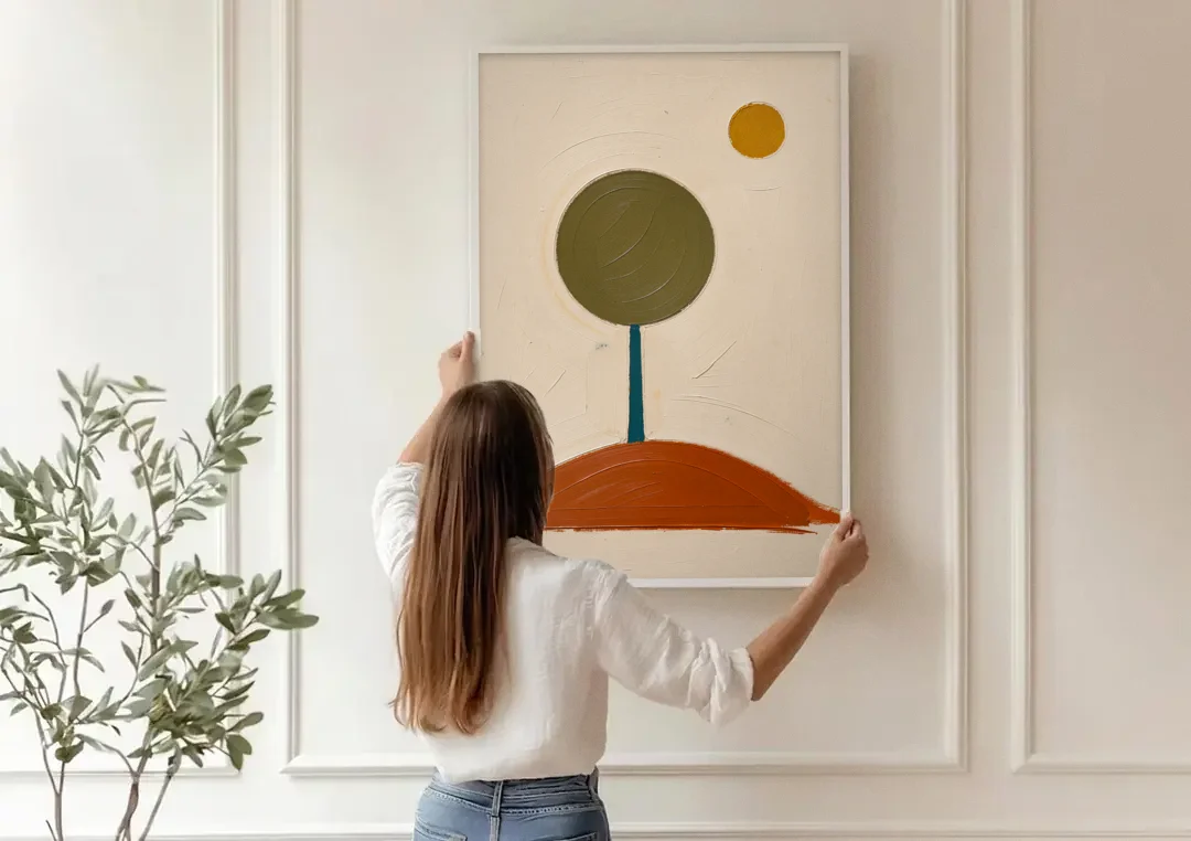 Mid Century Abstract Wall Art with Olive Circle Tree canvas wall art being hung on a paneled wall