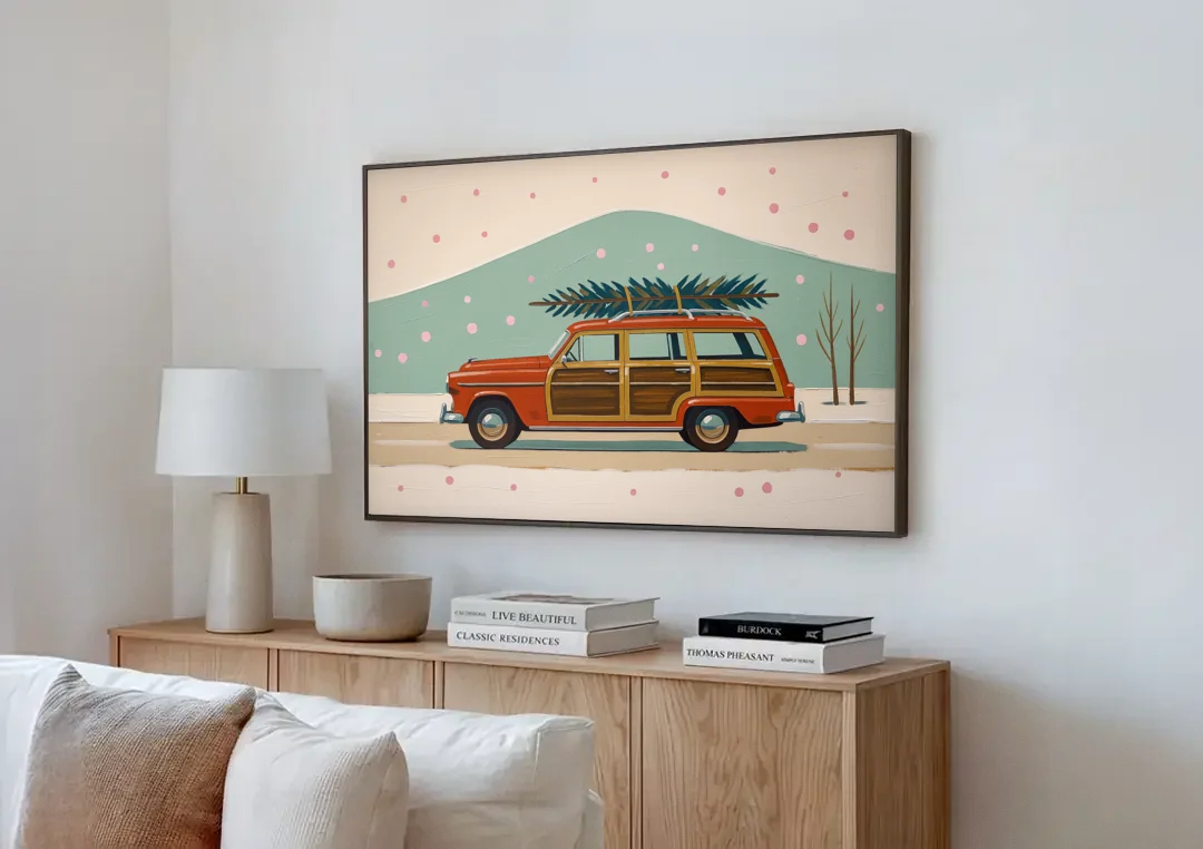 Mid Century Christmas Decor with a Woody Wagon canvas wall art above a wooden sideboard next to a sofa