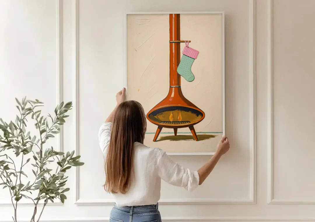 Mid-Century Christmas Wall Art of a Cone Fireplace canvas wall art being hung on a paneled wall