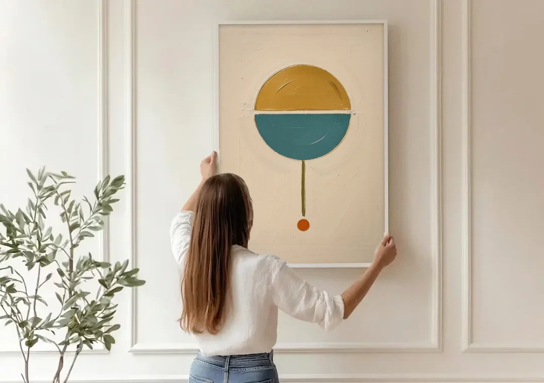 Mid Century Geometric Art with a Sliding Split Circle canvas wall art being hung on a paneled wall