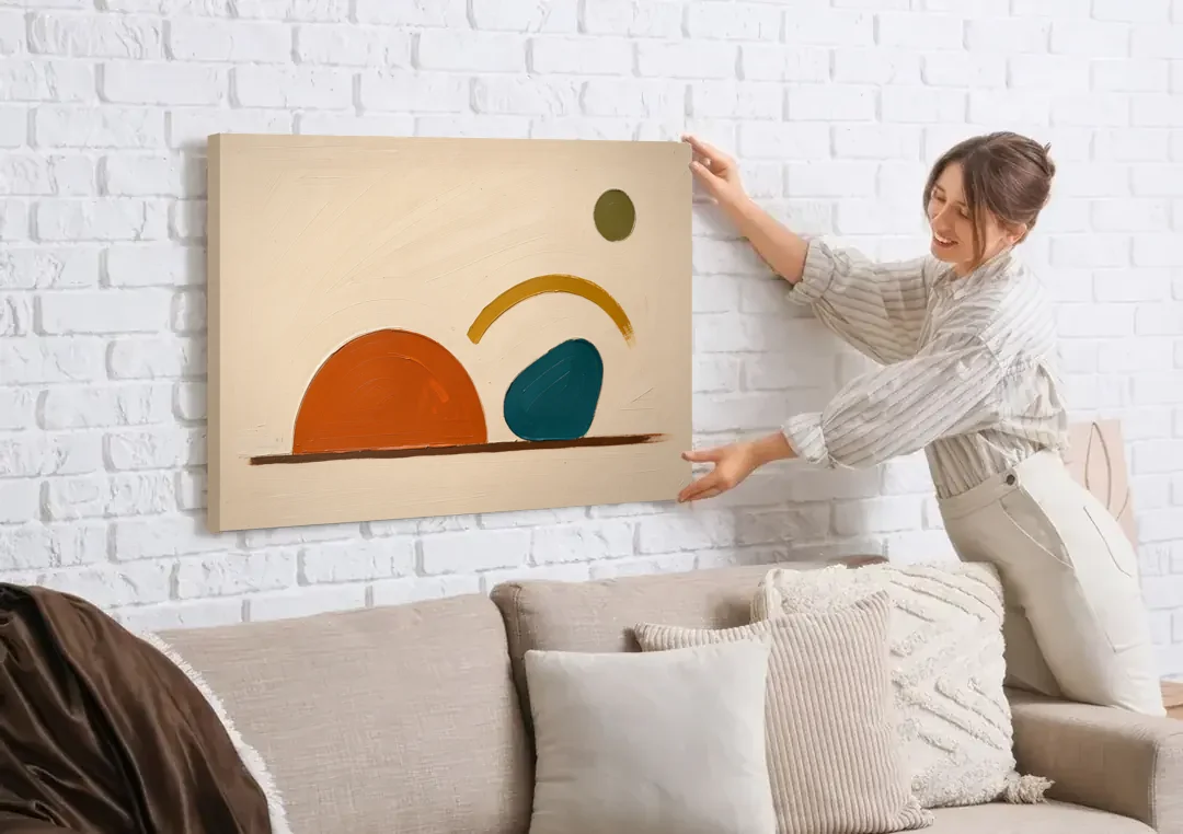 Mid Century Modern Art Half Circle With Teal Pebble canvas wall art being hung on a white brick wall above a sofa