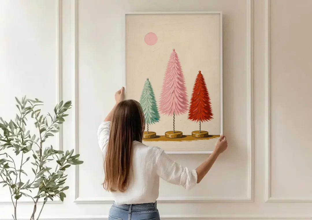 Mid Century Modern Holiday Decor of Bottle Brush Trees canvas wall art being hung on a paneled wall