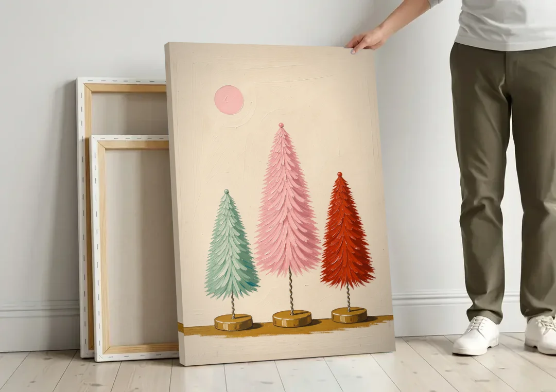 Mid Century Modern Holiday Decor of Bottle Brush Trees canvas wall art leaning against a wall next to blank canvases