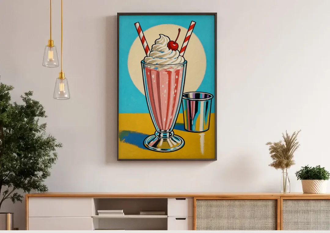 Milkshake Painting with Cherry and Chrome Cup canvas wall art above a wooden sideboard under pendant lights