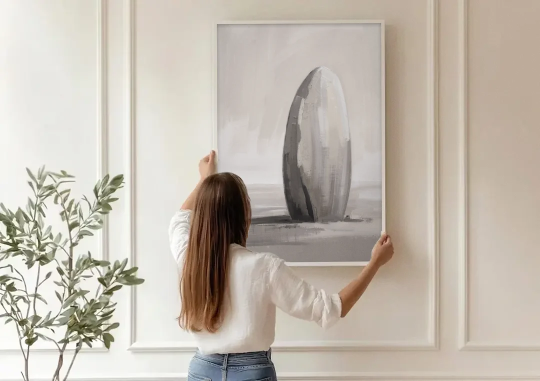 Minimalist Bedroom Standing Stone in Mist canvas wall art being hung on a paneled wall