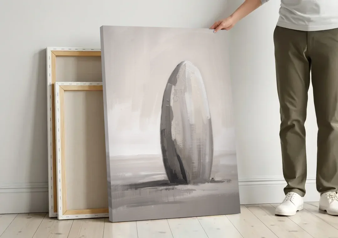 Minimalist Bedroom Standing Stone in Mist canvas wall art leaning against a wall next to blank canvases