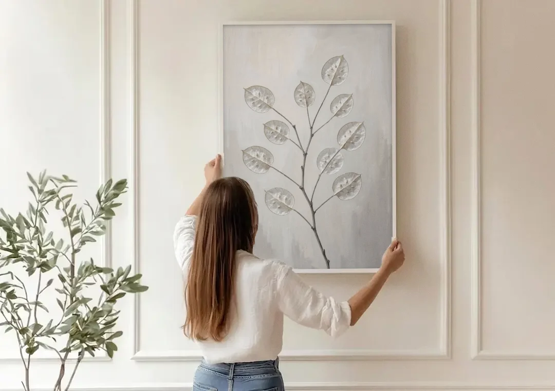 Minimalist Botanical Wall Art with Honesty Seed Pods canvas wall art being hung on a paneled wall